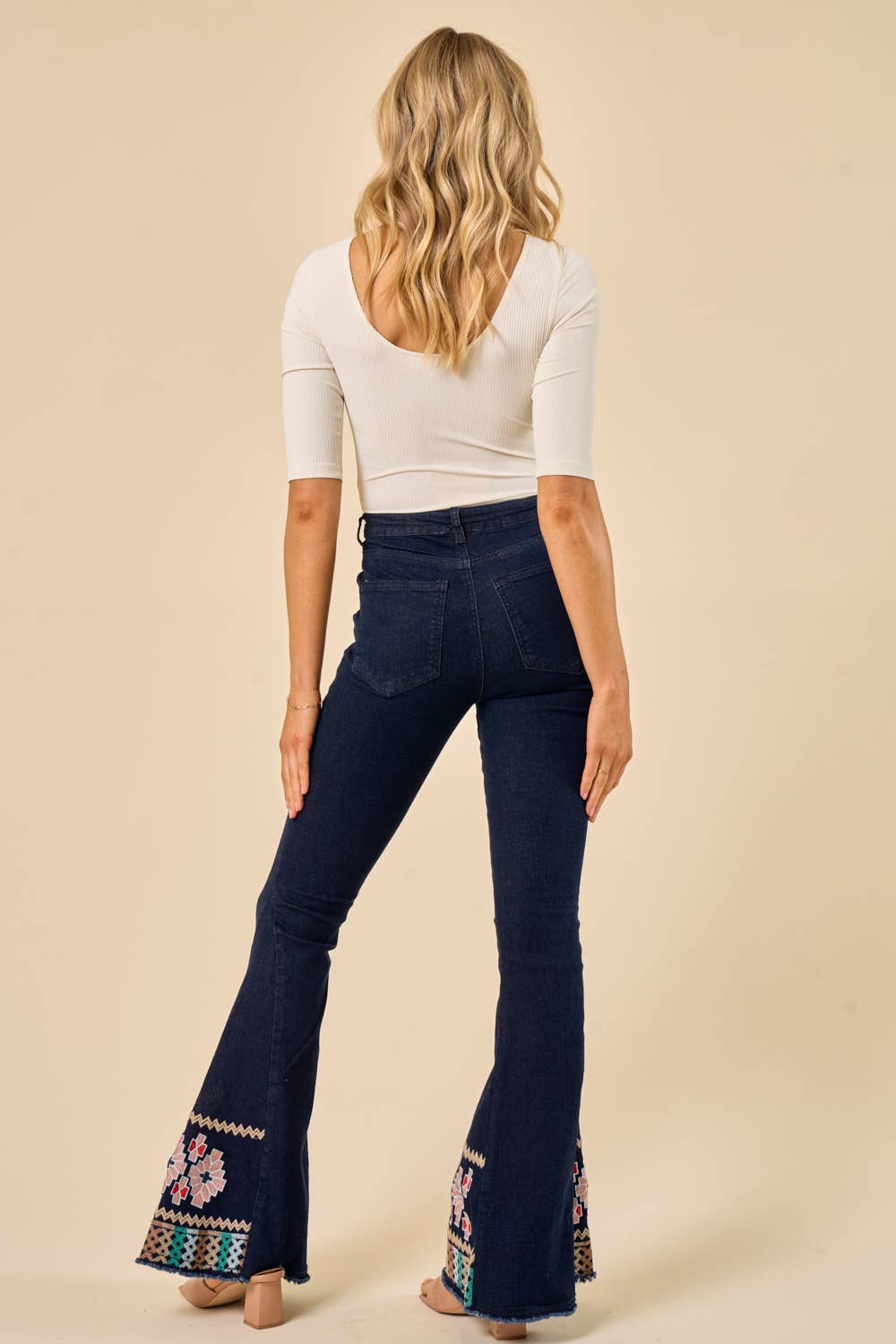 DARK DENIM BELLBOTTOMS WITH EMBROIDERY DETAIL