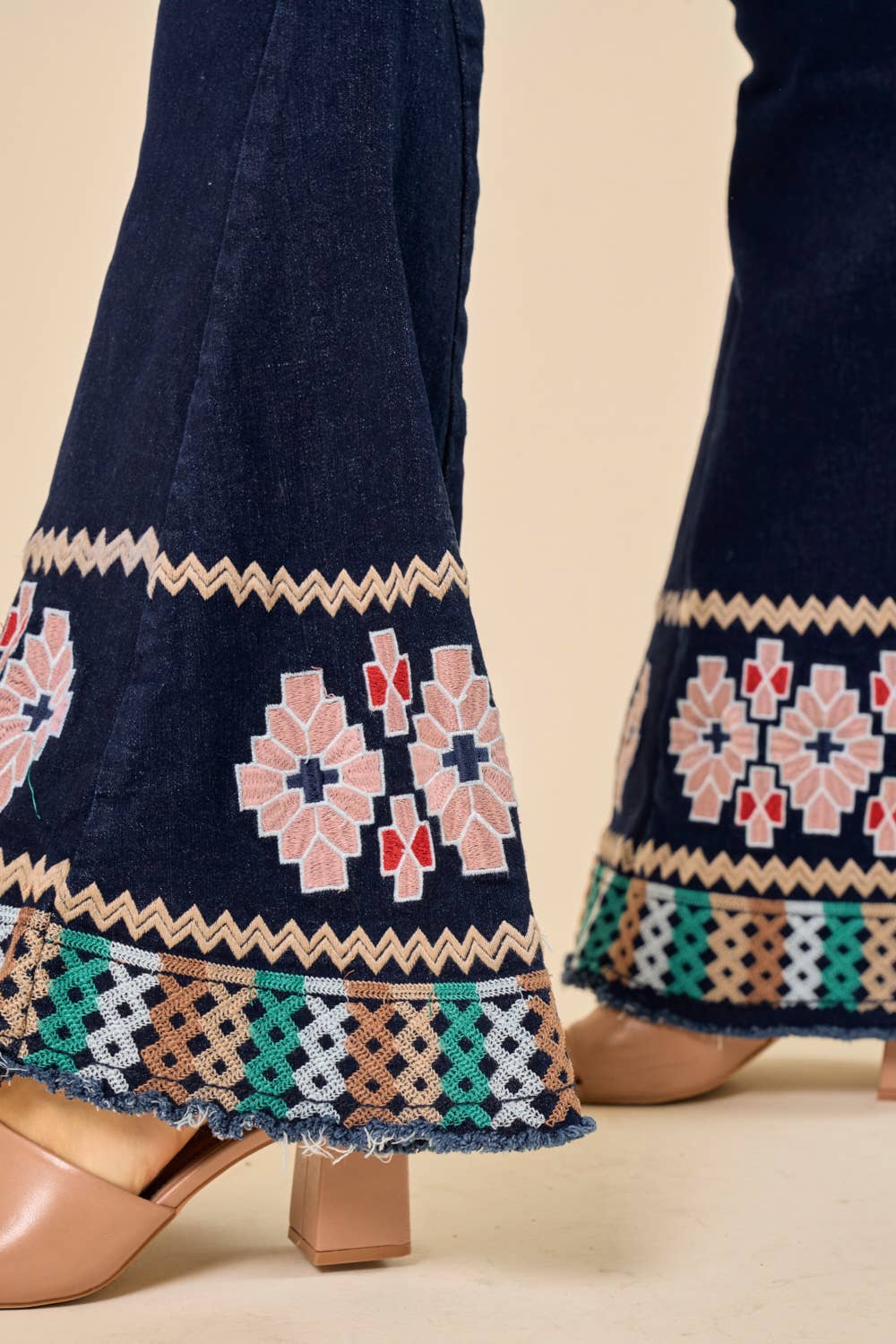DARK DENIM BELLBOTTOMS WITH EMBROIDERY DETAIL