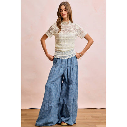 FLORAL TIERED FLARE DENIM PANTS